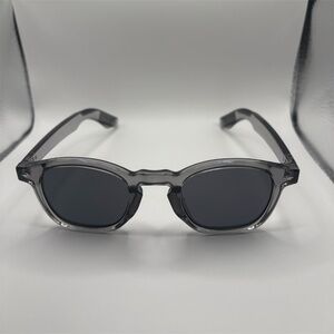 Gray round frame sunglasses with dark tinted lenses